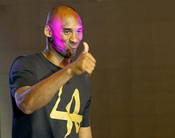 Kobe Bryant flashes a thumbs-up to his adoring fans. (AP)