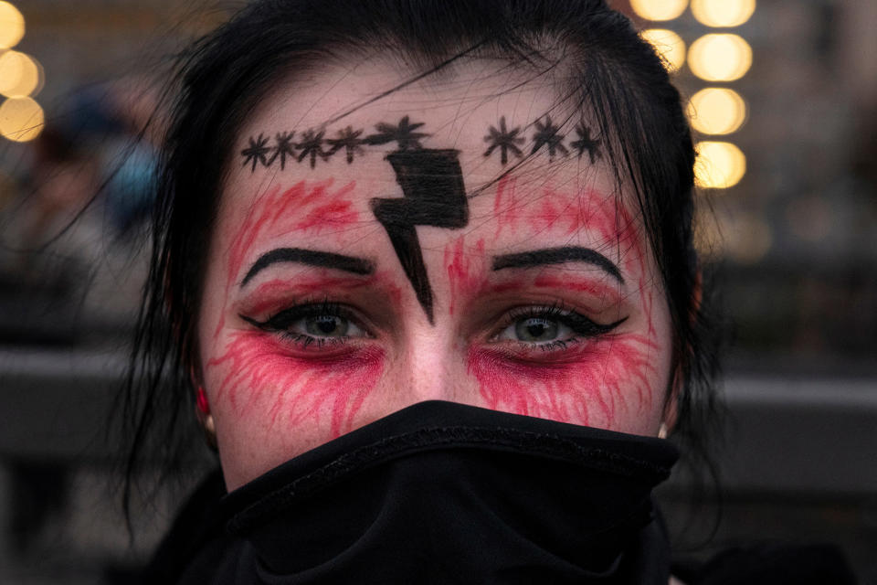 Image: A woman takes part in a protest against the ruling by Poland's Constitutional Tribunal that imposes a near-total ban on abortion, in Gdansk (Jadwiga Figula / Reuters)