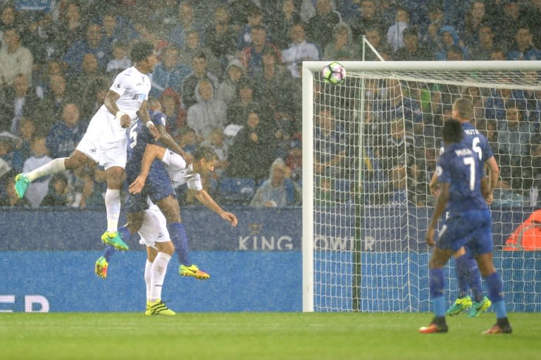 Swansea's Leroy Fer (L) heads to score against Leicester