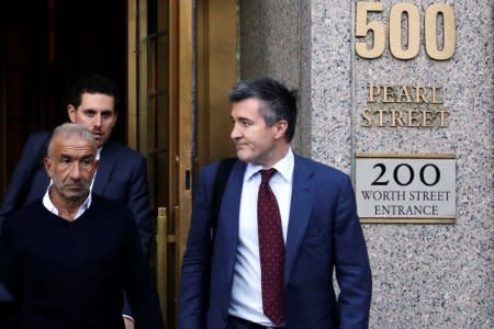 FILE PHOTO: Alain Kaloyeros (L), president of the State University of New York's Polytechnic Institute, walks out of the Manhattan federal courthouse in New York, U.S., September 22, 2016.  REUTERS/Bria Webb/File Photo - TM3ECAB17B201