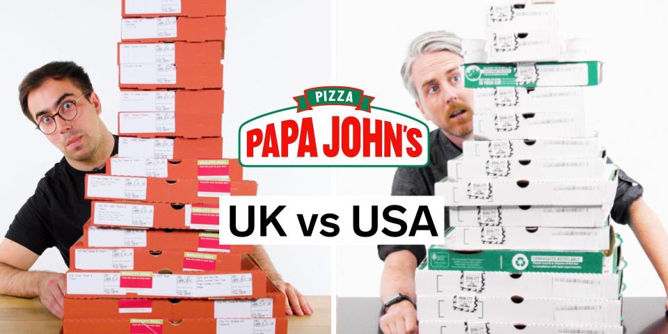 Harry Kersh and Joe Avella sitting behind stacks of Papa John's pizza boxes
