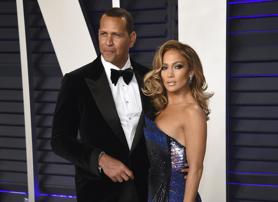 FILE - Alex Rodriguez, left, and Jennifer Lopez arrive at the Vanity Fair Oscar Party in Beverly Hills, Calif. on Feb. 24, 2019. Lopez and Rodriguez told the “Today” show Thursday, April 15,2021, in a joint statement that they are calling off their two-year engagement. (Photo by Evan Agostini/Invision/AP, File)