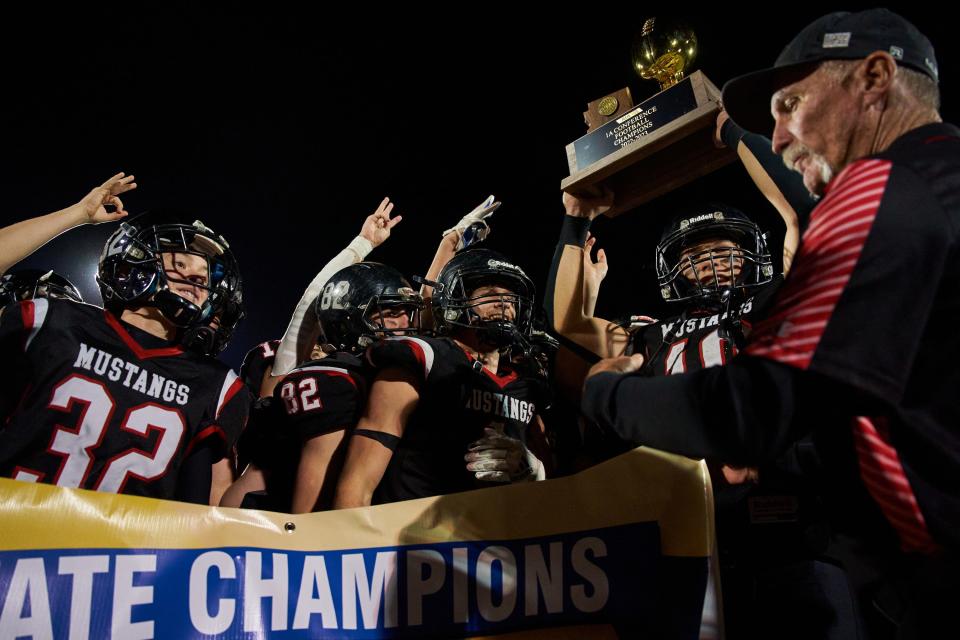 The Mogollon Mustangs celebrate their 1A state championship after defeating the Williams Vikings at Coronado High School football field in Scottsdale on Nov. 12, 2022.