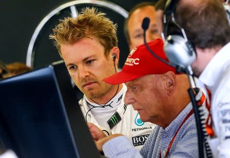 Formula One - Grand Prix of Austria - Spielberg, Austria - 2/7/16 - Mercedes Formula One driver Nico Rosberg of Germany and Mercedes represantative Niki Lauda after Rosberg crashing in training. REUTERS/Dominic Ebenbichler