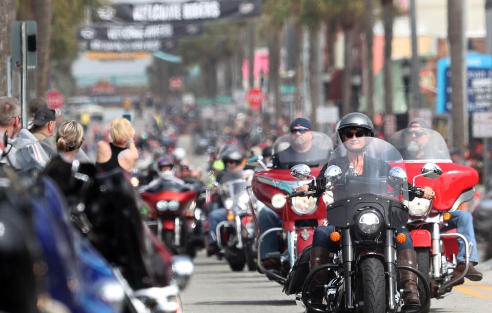 A lady rider leads a group of motorcycles cruising Main Street during Bike Week 2024 in Daytona Beach. Statistics show that the percentage of female riders nationally has doubled since 2009.