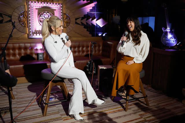<p>Jason Kempin/Getty Images for PEOPLE x IHG Hotels and Resorts</p> Megan Moroney and PEOPLE executive editor Melody Chiu at PEOPLE x IHG Hotels pre-CMA Awards event on Nov. 6, 2023 in Nashville