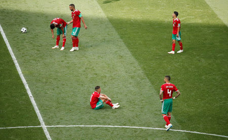 Soccer Football - World Cup - Group B - Portugal vs Morocco - Luzhniki Stadium, Moscow, Russia - June 20, 2018 Morocco players look dejected after the match REUTERS/Christian Hartmann