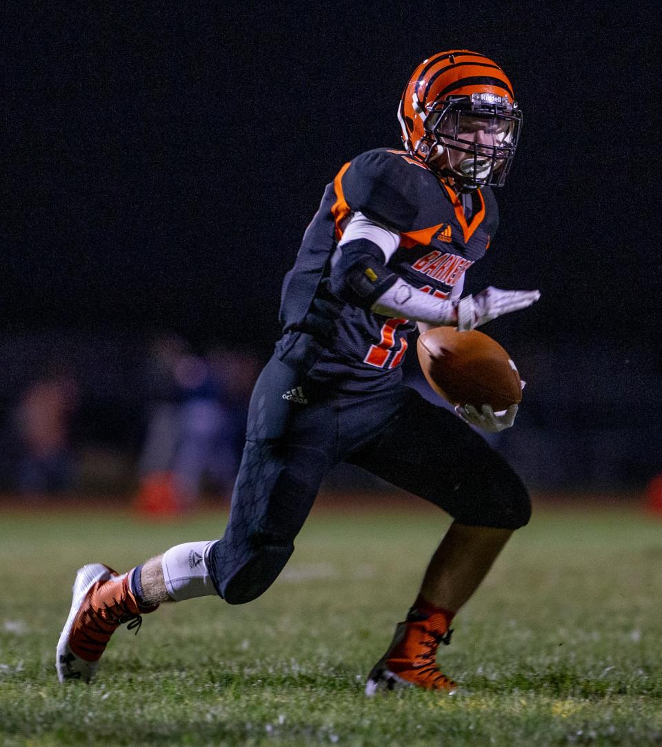 A Barnegat football player is shown on the home field in 2019.