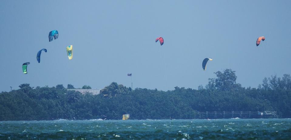 Kiteboarders are seen just before the Sanibel Causeway on Thursday, March 18, 2021. Kiters and other wind enthusiasts will get a chance to experience strong winds later this week as a cold front works its way across the state.