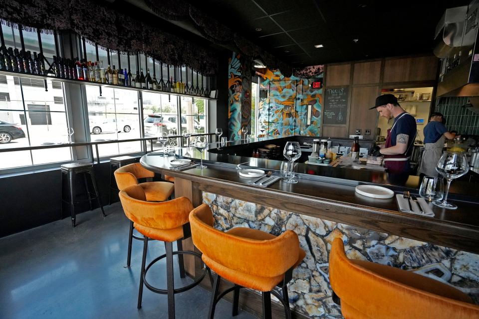 Fourteen stools line 1033's bar, where diners can watch their food being made right in front of them.