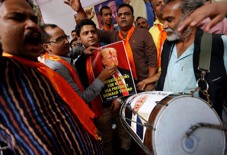 Members of Hindu Sena, a right-wing Hindu group, symbolically celebrate the victory of U.S. Republican presidential nominee Donald Trump in the upcoming U.S. elections, in New Delhi, India, November 4, 2016. REUTERS/Adnan Abidi