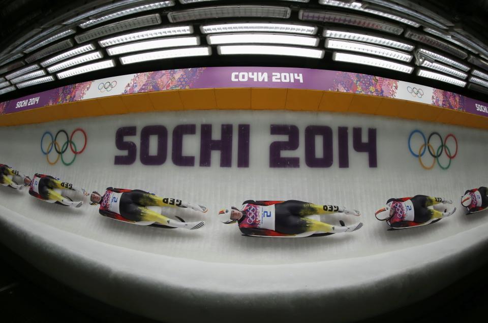 Germany's Natalie Geisenberger speeds down the track in the women's singles luge event of the Sochi 2014 Winter Olympic Games, at the Sanki Sliding Center, Rosa Khutor February 10, 2014. Picture taken using multiple-exposure. REUTERS/Fabrizio Bensch