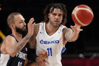 Czech Republic's Blake Schilb (11) passes under pressure from France's Evan Fournier (10) during a men's basketball preliminary round game at the 2020 Summer Olympics in Saitama, Japan, Wednesday, July 28, 2021. (AP Photo/Charlie Neibergall)