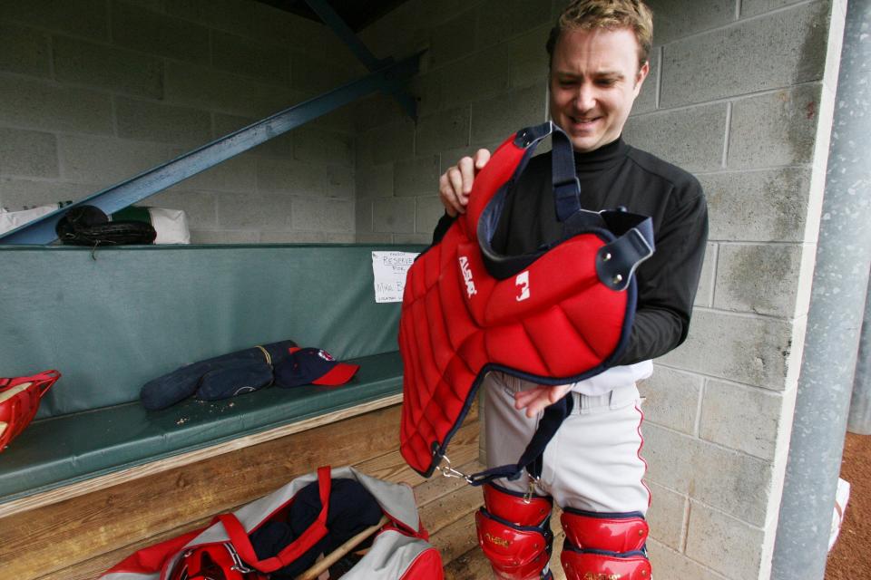 Joe McDonald puts on the pads and tries to catch PawSox knuckleballer Charlie Zink for a story in 2006.