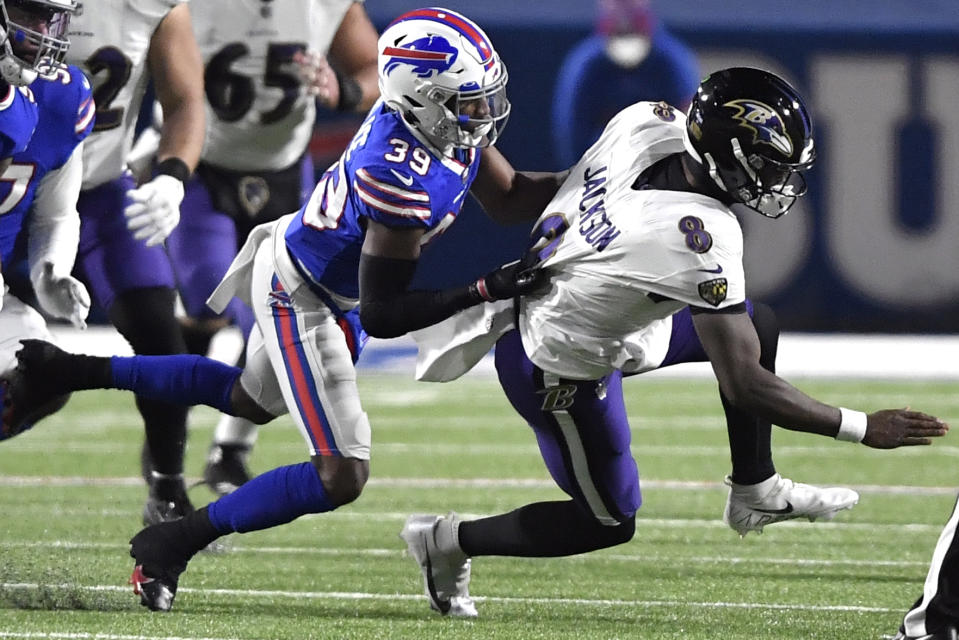 Buffalo Bills cornerback Levi Wallace (39) sacks Baltimore Ravens' Lamar Jackson (8) during the first half of an NFL divisional round football game Saturday, Jan. 16, 2021, in Orchard Park, N.Y. (AP Photo/Adrian Kraus)