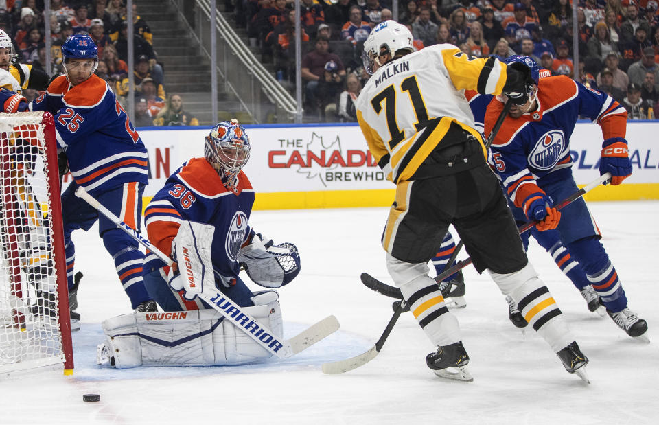 Pittsburgh Penguins' Evgeni Malkin (71) is stopped by Edmonton Oilers goalie Jack Campbell (36) during the first period of an NHL hockey game in Edmonton, Alberta, on Monday, Oct. 24, 2022. (Jason Franson/The Canadian Press via AP)