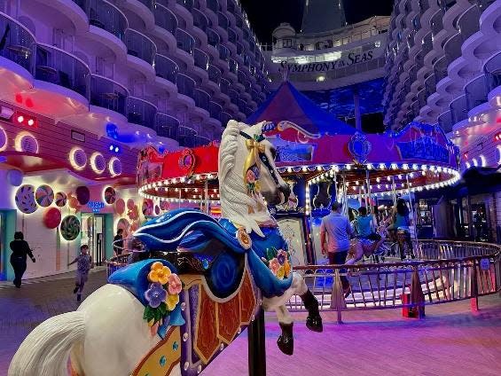 Symphony of the Seas Boardwalk with purple lighting and games