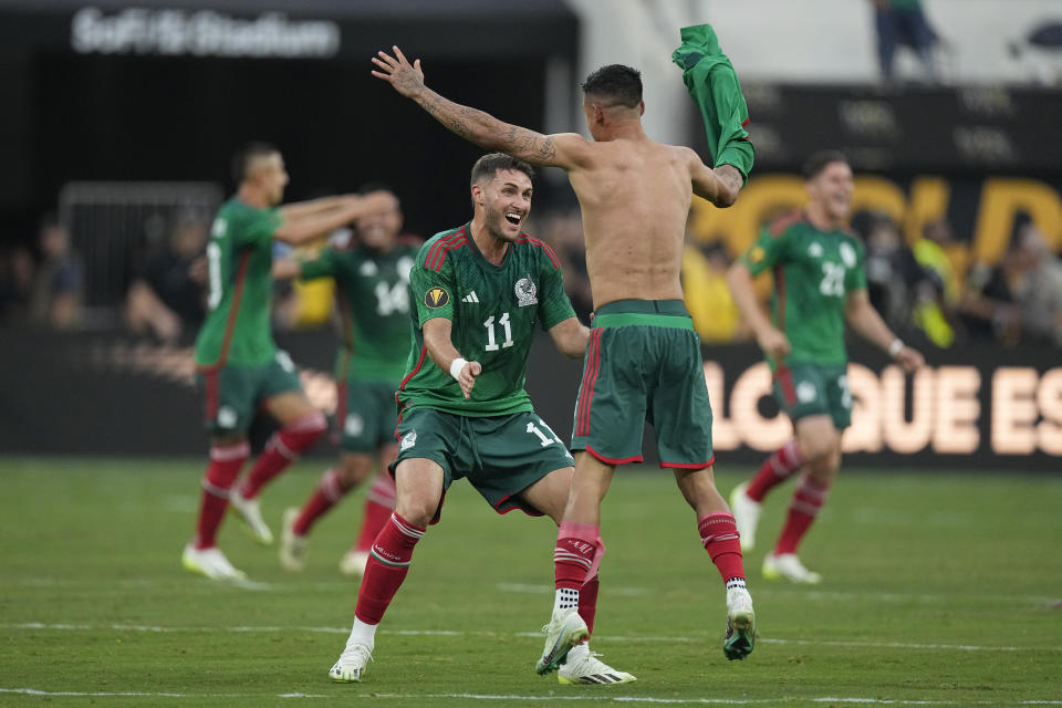 Mexico's Santiago Gimenez (11) celebrates with a teammate after a 1-0 win over Panama during the CONCACAF Gold Cup final soccer match Sunday, July 16, 2023, in Inglewood, Calif. (AP Photo/Mark J. Terrill)