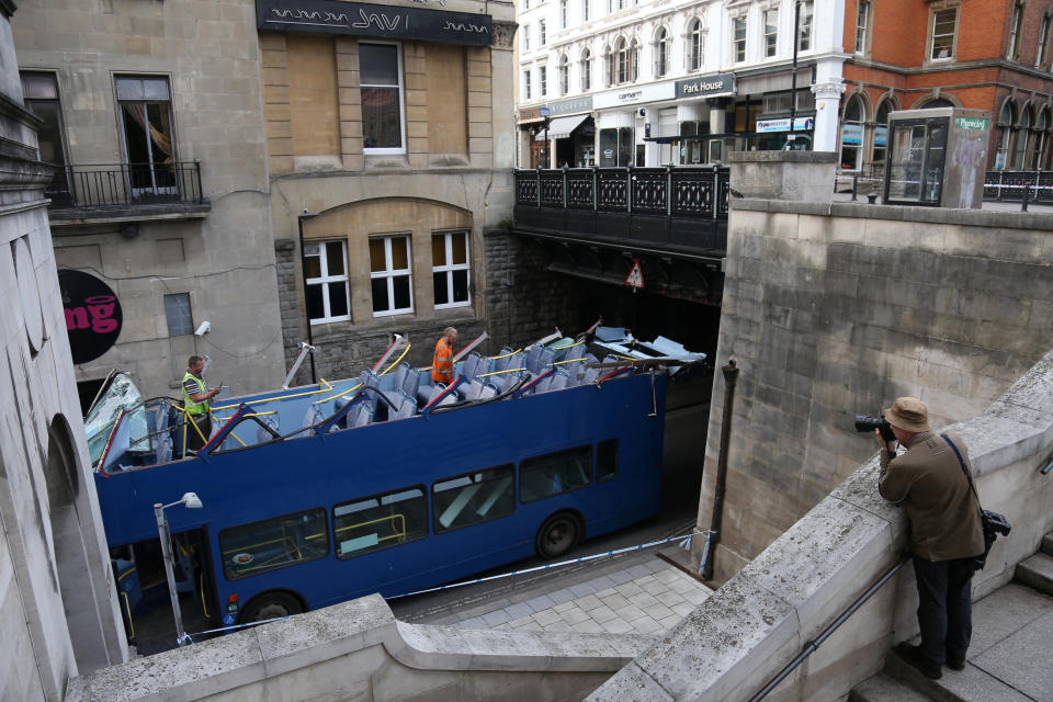 Witnesses said. thebridge 'took. the full impact' of the crash, which also smashed all the bus's windows. (SWNS)