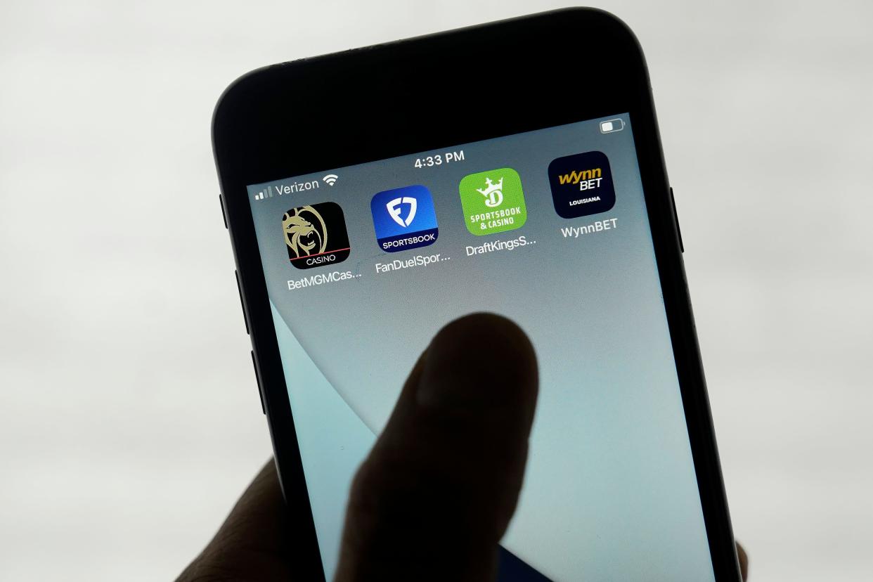 FanDuel, DraftKings and other online gambling apps are displayed on a phone in San Francisco, Monday, Sept. 26, 2022.