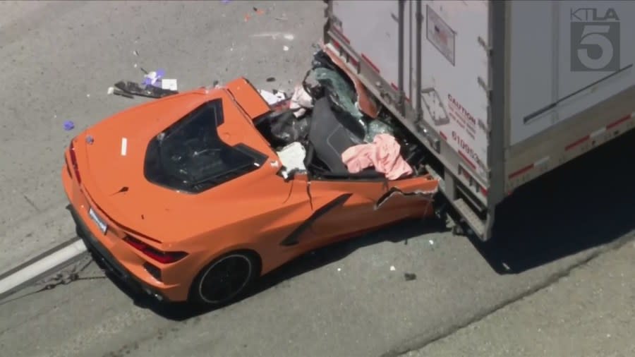 A Chevrolet Corvette was flattened after it smashed into the back of a semi-truck on the 5 Freeway near Castaic on May 9, 2024. (KTLA)