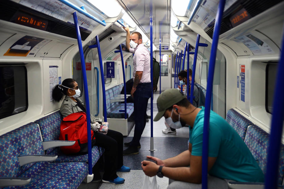 Passengers wearing face masks travel on the Victoria line tube, amid the spread of the coronavirus disease (COVID-19) in London, Britain June 15, 2020. REUTERS/Hannah McKay