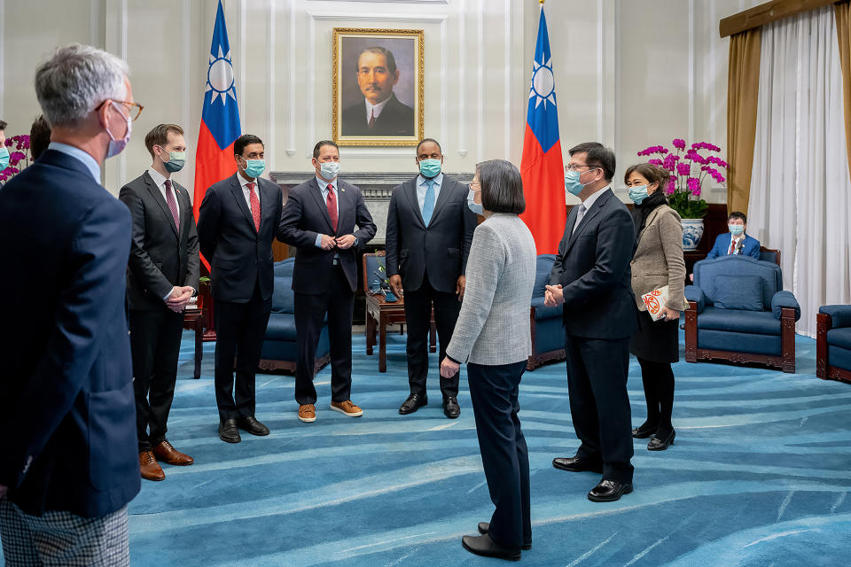 In this photo released by the Taiwan Presidential Office, Taiwan's President Tsai Ing-wen, center, meet with a U.S. delegation led by California Rep. Ro Khanna, third from left during a meeting at the Presidential Office in Taipei, Taiwan on Tuesday, Feb. 21, 2023. A delegation of U.S. lawmakers led by Khanna on Tuesday met with Taiwan's president, who promised to deepen military cooperation between the two sides despite objections from China, which claims the island as its own territory. (Taiwan Presidential Office via AP)