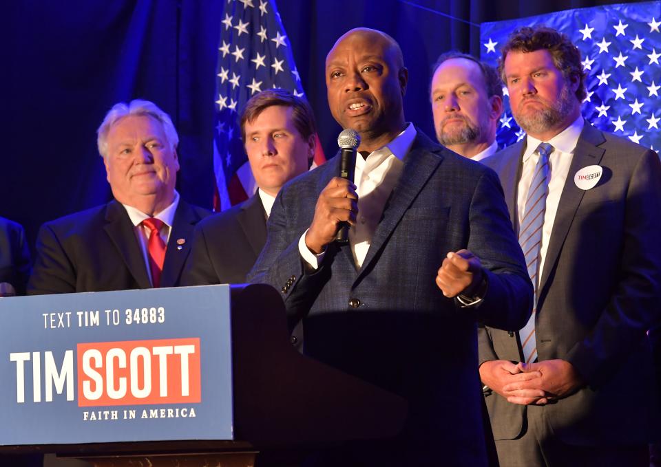 Presidential candidate U.S. Sen. Tim Scott of South Carolina, center, campaigns at the AC Hotel Spartanburg on Monday, June 12, 2023. 
