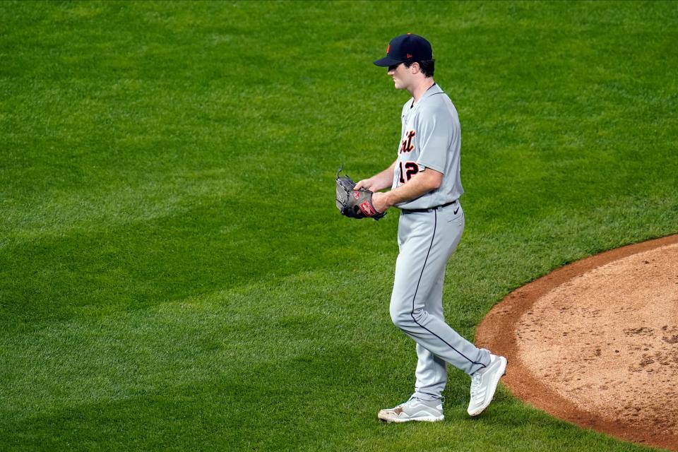 Detroit Tigers pitcher Casey Mize heads to the dugout after he was pulled following a two-run home run by Minnesota Twins' Eddie Rosario in the fifth inning of a baseball game, Wednesday, Sept. 23, 2020, in Minneapolis.