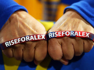 A fan with some 'Rise for Alex' wristbands.