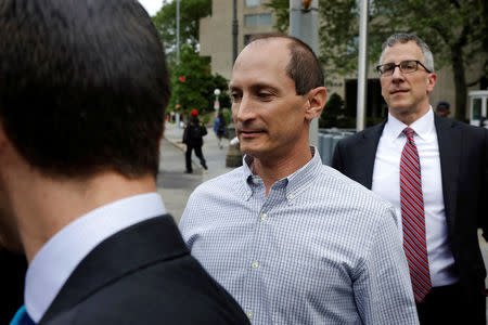 Rob Olan (C), employee of the healthcare investment fund Deerfield Management, departs Federal Court in Manhattan after an arraignment for insider trading in New York, U.S., May 24, 2017. REUTERS/Lucas Jackson