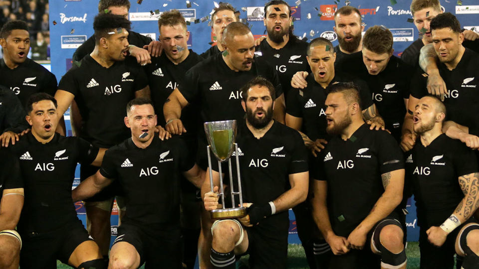 Seen here, New Zealand players pose with the 2018 Rugby Championship trophy.