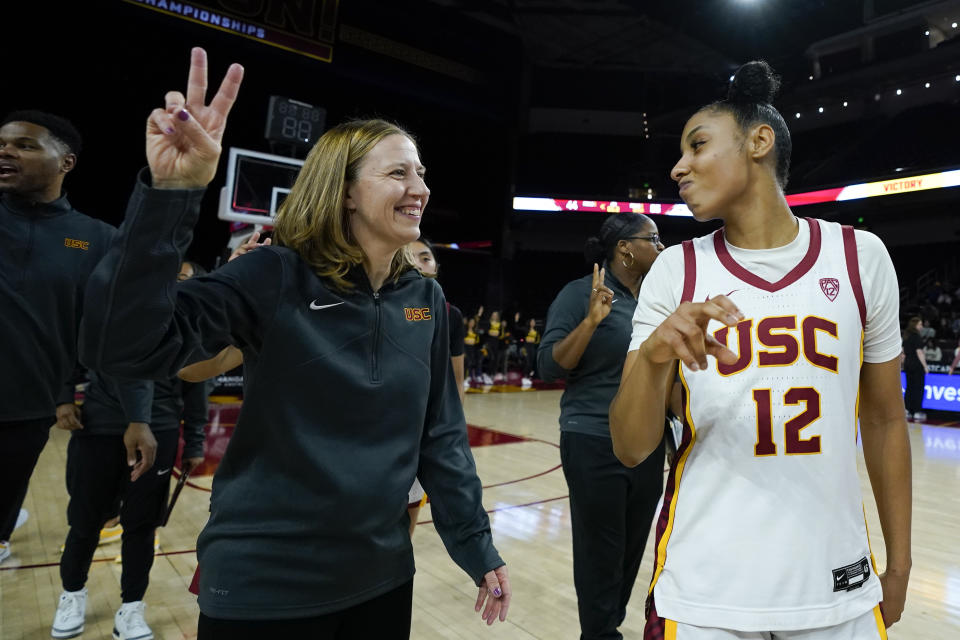 Southern California head coach Lindsay Gottlieb, left, and guard JuJu Watkins (12) react after the team's victory over Cal Poly, Tuesday, Nov. 28, 2023, in Los Angeles. (AP Photo/Ryan Sun)