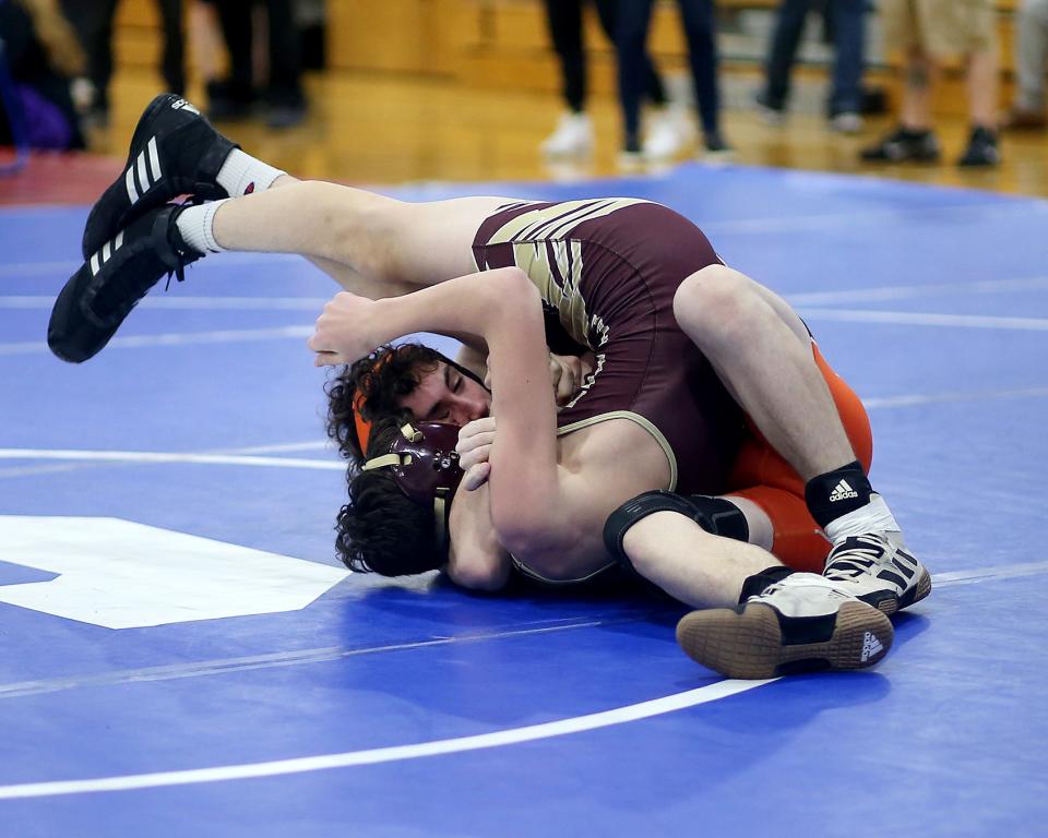 Middleboro’s Matthew Patterson (120 lbs) has a hold of Shepherd Hill’s Sawyer Ayotte during the Kevin Curtis Wrestling Tournament at Scituate High School on Saturday, Dec. 11, 2021.