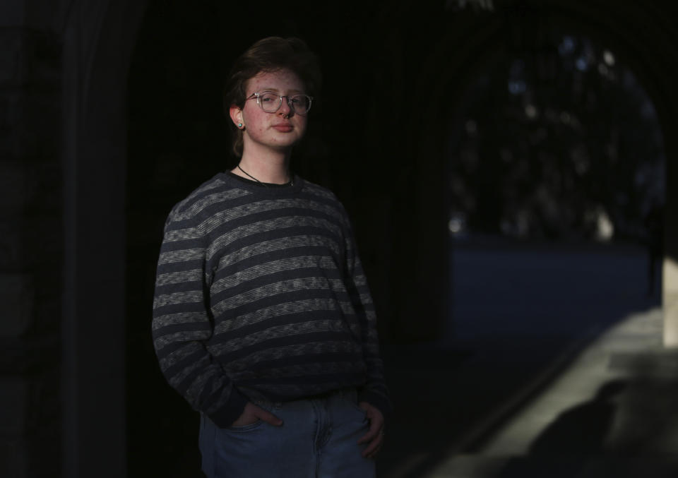 Eli Musselman poses for a portrait at St. Joseph's University in Philadelphia on Monday, Feb. 14, 2022. Eli encountered hostility from some in his family's Catholic parish when he came out as transgender almost four years ago but has found support as a freshman at the Jesuit-run university from friends and professors. (AP Photo/Jessie Wardarski)