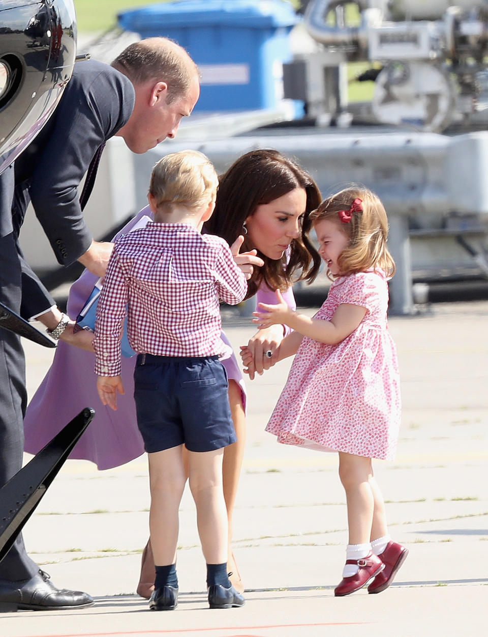 Kate Middleton, Princess Charlotte, Prince George and Prince William view helicopter models H145 and H135 before departing from Hamburg airport on the last day of their official visit to Poland and Germany on July 21, 2017 in Hamburg, Germany.