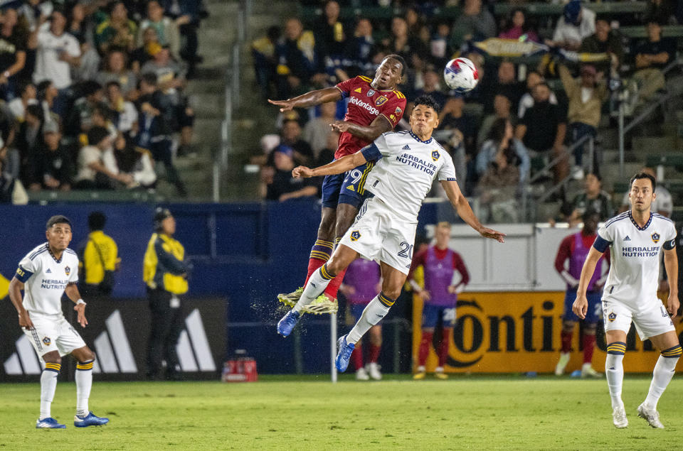 Anderson Julio #29 of Real Salt Lake competes for a header against Edwin Cerrillo #20 of Los Angeles Galaxy during the game at Dignity Health Sports Park on Oct. 14, 2023 in Los Angeles, California.