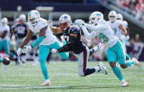 <p>Rob Gronkowski #87 of the New England Patriots is unable to catch a pass as he is defended by T.J. McDonald #22 and Minkah Fitzpatrick #29 of the Miami Dolphins during the first half at Gillette Stadium on September 30, 2018 in Foxborough, Massachusetts. (Photo by Maddie Meyer/Getty Images) </p>