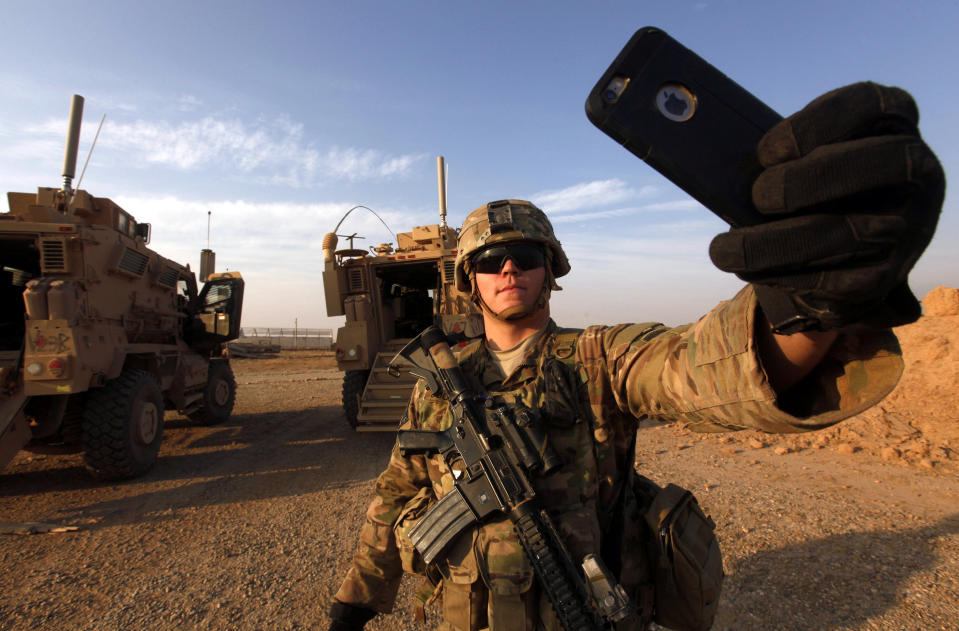 An American soldier takes a selfie at the U.S. army base in Qayyara, south of Mosul October 25, 2016. REUTERS/Alaa Al-Marjani