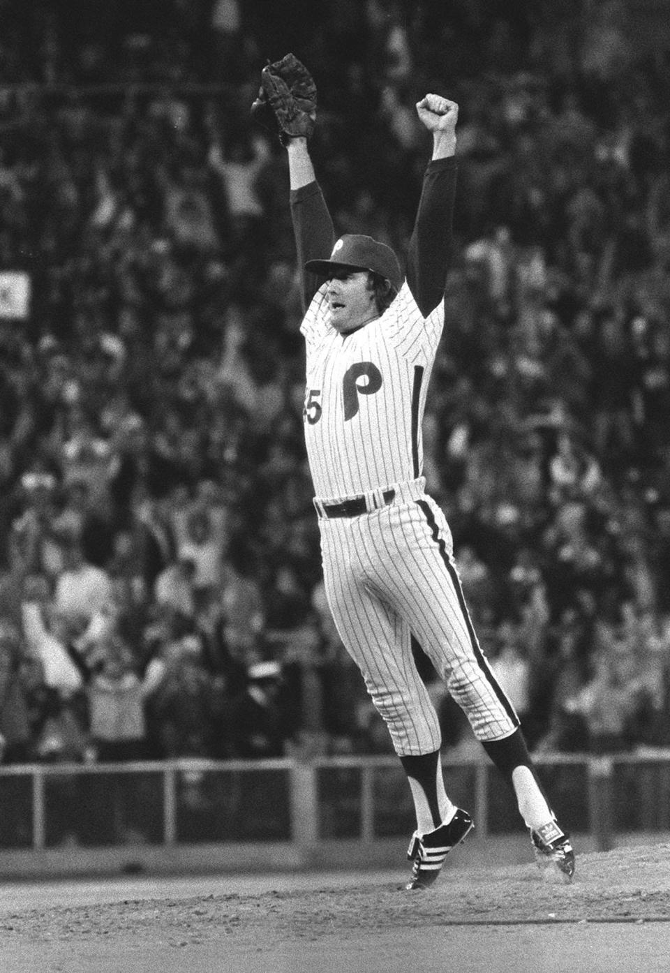 Philadelphia Phillies pitcher Tug McGraw leaps of the mound after striking out the last Kansas City Royals batter in the ninth inning as the Phillies won the first game of the World Series, 7-6, in Philadelphia, Pa., on Oct. 14, 1980.  (AP Photo)