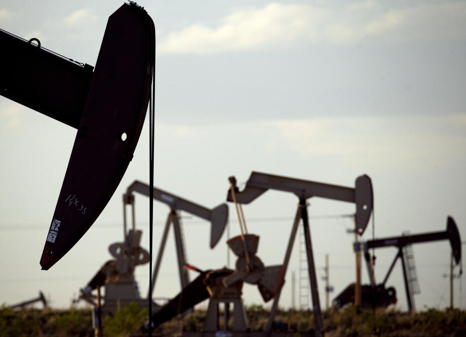 FILE - Pump jacks work in a field near Lovington, N.M., April 24, 2015. Oil and gas companies will have to pay more to drill on public lands and satisfy stronger requirements to clean up old or abandoned wells under a final rule issued Friday, April 12, 2024, by the Biden administration. The Interior Department rule does not go so far as to prohibit new oil and gas leasing on public lands, as many environmental groups have urged and as President Joe Biden promised during the 2020 campaign. (AP Photo/Charlie Riedel, File)