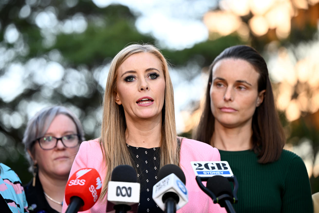 Animal Justice Party PM Emma Hurst pictured here at a separate inquiry in June, standing in front of microphones.