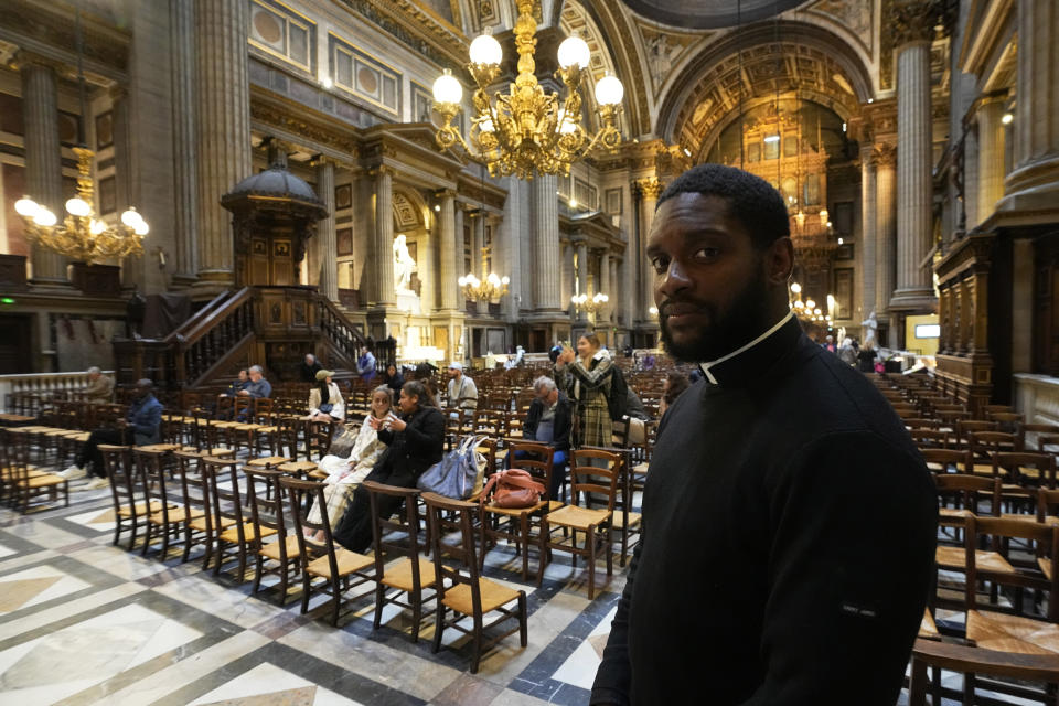 Jason Nioka,, a former judo champion and deacon who's in charge of the largest contingent of Olympic chaplains, about 40 priests, nuns and lay Catholics, poses inside the Madeleine church, Thursday, May 30, 2024 in Paris. As athletes rev up their training and organizers finalize everything from ceremonies to podiums before the Paris Olympics, more than 120 faith leaders are preparing for a different challenge – spiritually supporting some 14,000 participants from around the world, especially those whose medal dreams will inevitably get crushed. (AP Photo/Michel Euler)