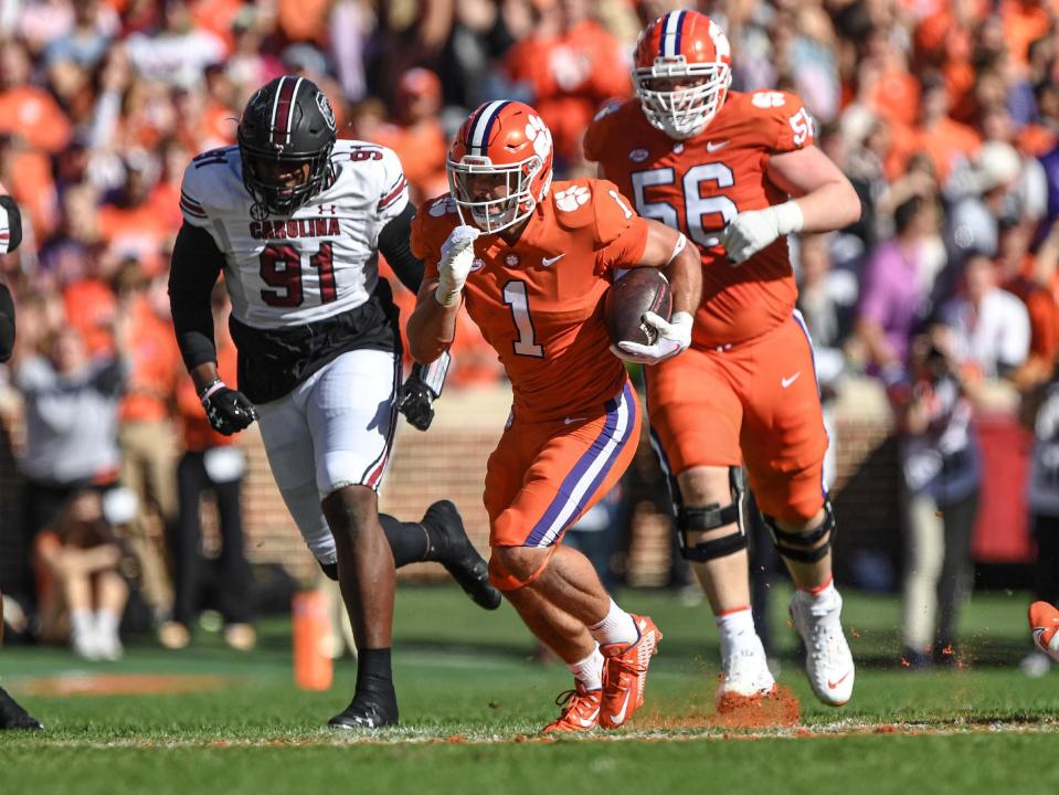 Clemson running back Will Shipley (1) runs by South Carolina defensive tackle Tonka Hemingway (91) during their 2022 game at Memorial Stadium.