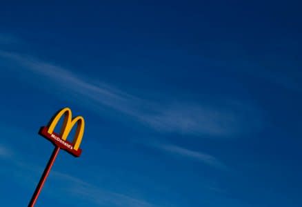 FILE PHOTO: A sign for the U.S. fast food restaurant chain McDonald's is seen outside one of their restaurants in Sint-Pieters-Leeuw, near Brussels, Belgium February 14, 2018.  REUTERS/Yves Herman