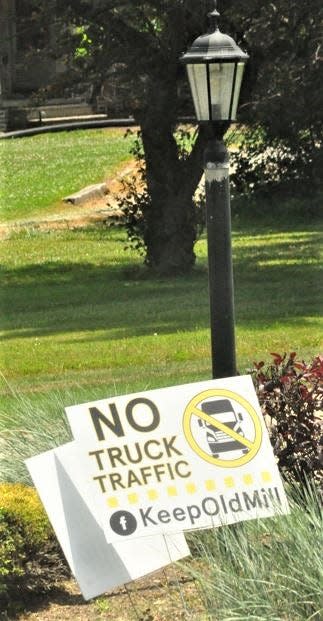 This sign at a residence on Old Mill Road is one of many which have been placed along the road and on other properties around the city. It expresses sentiments relating to the city’s approval of a site plan for two large industrial buildings on the north side of Old Mill.