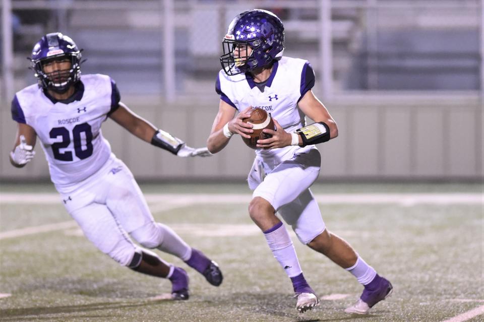 Roscoe's Seth Wilcox (4) returns an interception during a Region II-2A Division II bi-district playoff against Quanah on Nov. 11.