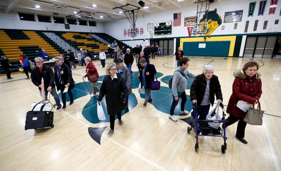 Des Moines, Iowa, residents enter a caucus site at Hoover High School on Monday. (Photo: Charlie Neibergall/ASSOCIATED PRESS)