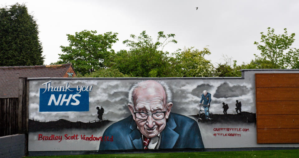 A mural that has been created to pay tribute to NHS fundraiser Captain Tom Moore outside Bradley Scott Windows in Tamworth, Staffordshire. (Photo by Jacob King/PA Images via Getty Images)