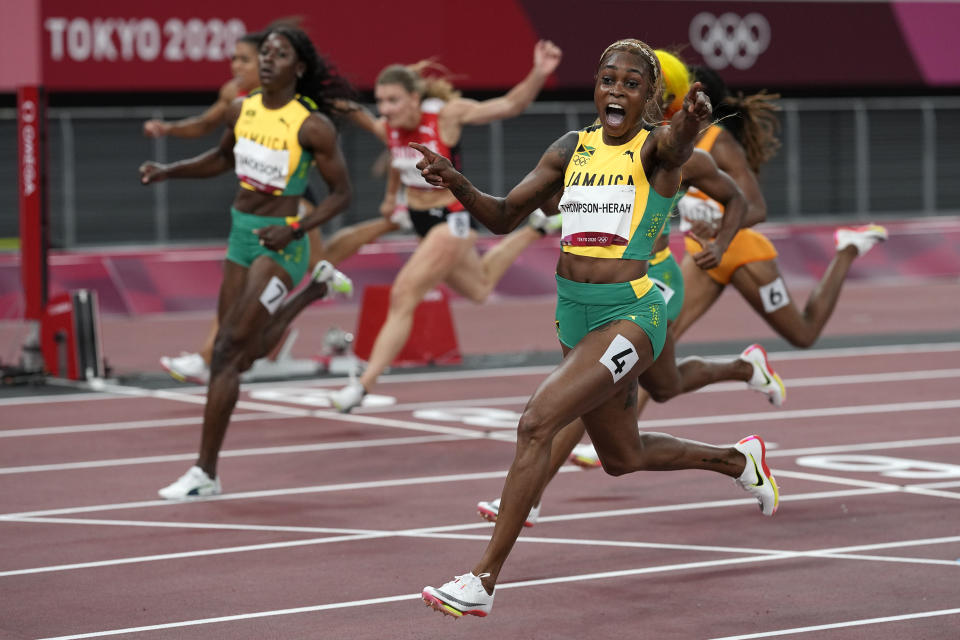 Elaine Thompson-Herah of Jamaica, celebrates as she wins the women's 100-meters final at the 2020 Summer Olympics, Saturday, July 31, 2021, in Tokyo. (AP Photo/David J. Phillip)